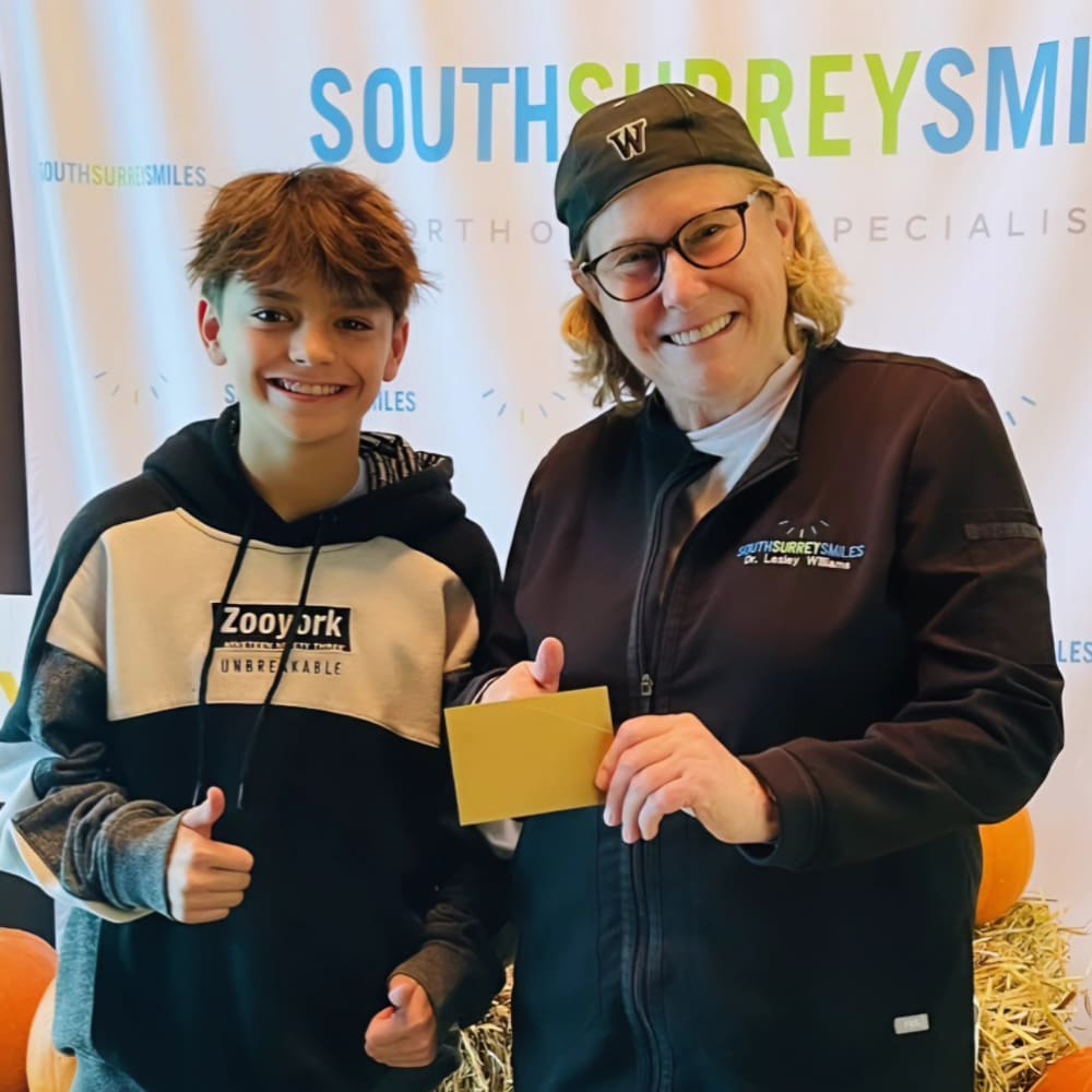 Dr. Lesley Williams stands with a patient at South Surrey Smiles.