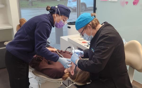 The team at South Surrey Smiles works on a patient.